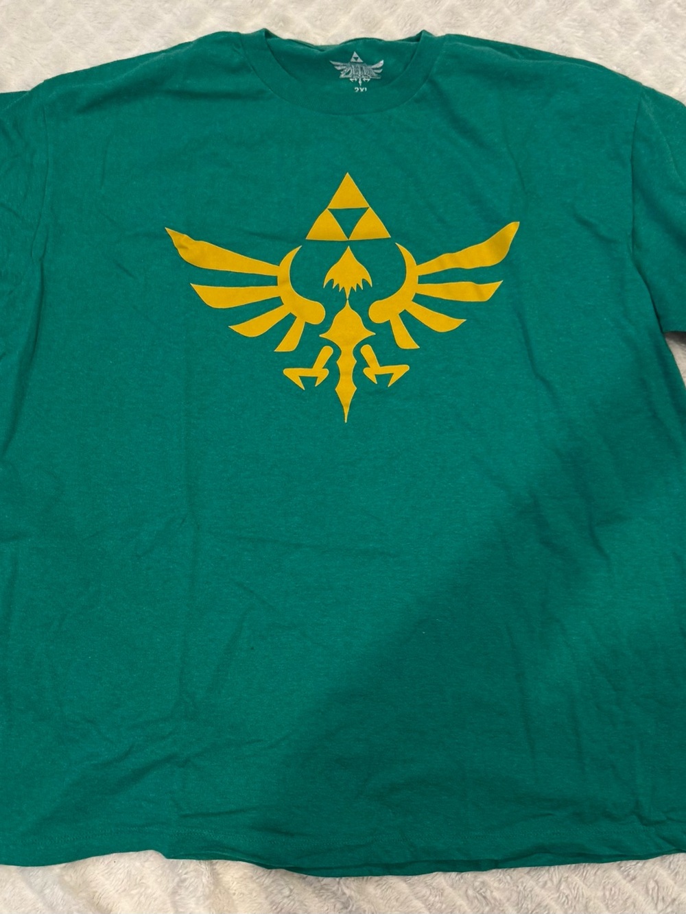 Zelda Green Graphic Tee with Yellow Triforce Emblem